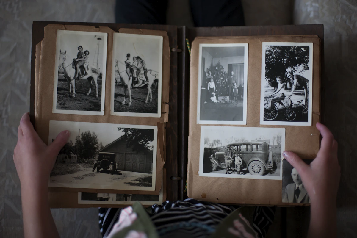 A family member looking through an album of old photographs